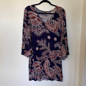 Love this fun flowy mini with ruffled bell sleeves from Ella Moss.💕